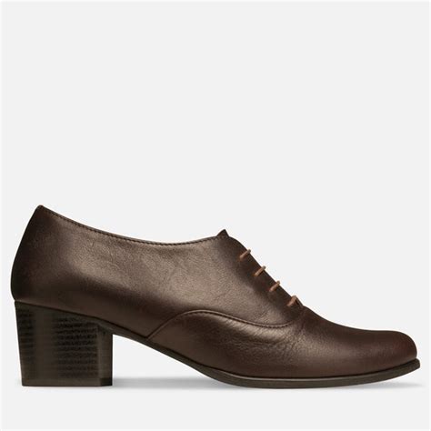 Julia bo shoes. Brighton - Cutout Oxfords. $165.00. 3 reviews. Leather; upper & lining. Man-made sole. 2.5 cm / 1.0" heel height. Handcrafted in Europe. Description & Materials. These cut-out oxford shoes are accented with cut-out detail along the sides and contrast wood colour sole, lending a fashion-forward accent to weekend and work wardrobes. 