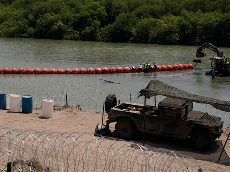 Justice Department sues to force Texas to remove floating barriers in Rio Grande