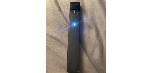 Blinking blue light. So I just got my Juul 2 DAYS AGO and it’s already not working. When I double tap it it shows a green light and iknow it’s full because it’s been charging. Then when I go to hit it it won’t hit or light up. When I take the pod out and put it back in it blinks a blue light.. 