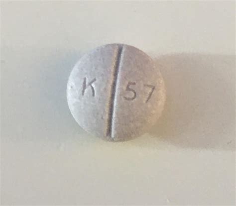 This blue round pill with imprint Logo 67 