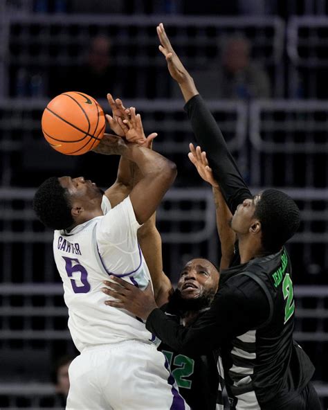 Kansas State guard Markquis Nowell (1) steals the ball from Michigan State forward Malik Hall in overtime of a Sweet 16 college basketball game in the East Regional of the NCAA tournament at .... 