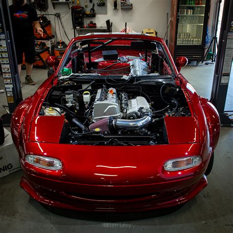 This 1990 Mazda MX-5 Miata is a red-over-black convertible that was modified during prior ownership, with work said to include installation of a 5.7-liter LS1 V8 and Tremec T-56 six-speed manual transmission sourced from a Camaro utilizing a Boss Frog V8 swap kit. ... of a 5.7-liter LS1 V8 and Tremec T-56 six-speed manual transmission sourced .... 