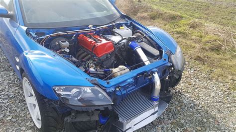 In the future when there are more wrecked Accords you could attempt a K20C swap. K swap rx7 would be great, could do a 9500 rev limit and it would feel like a rotary but torquier. Sure k-swap could be great in its own way, but it wouldn't feel like a rotary. They are their own animal and are special in their own right.. 