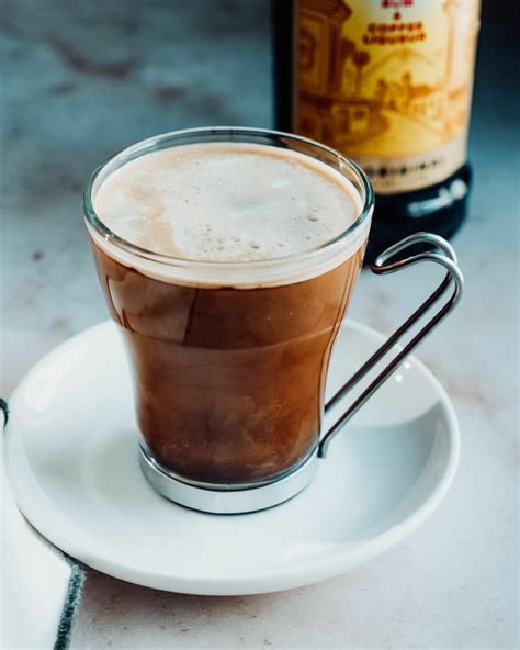 Kahlua and coffee. Add the Kahlúa Original, Absolut Vodka, Espresso and Simple Syrup into a shaker. 2. Add the ice. 3. Shake for 15 – 20 seconds, to build up lots of that velvety foam. 4. Strain into a retro martini or cocktail glass – not forgetting the foam! 