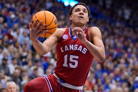 September 11, 2023 7:00 AM. Lawrence. Kansas super-senior men’s basketball guard Kevin McCullar Jr. entered a shaded courtyard at the bottom of Campanile Hill, next to the Jayhawks’ football .... 