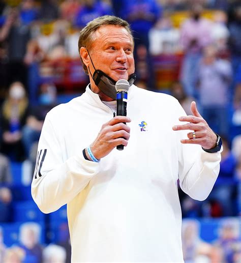 Kansas head coach Bill Self flashes a smile toward the fans as