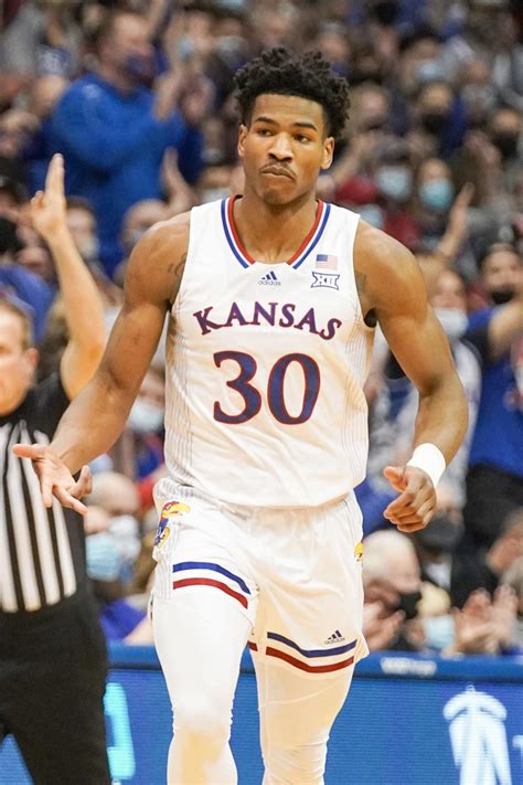 Guard Ochai Agbaji #30 of the Kansas Jayhawks gestures to his teammates during the second half of the college basketball game against the Texas Tech Red Raiders on March 07, 2020 at United .... 