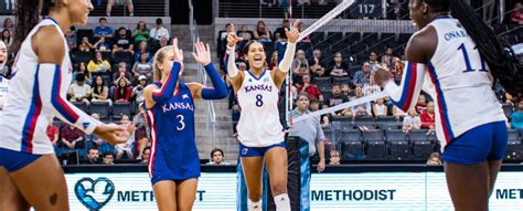 The Kansas volleyball team, and the Horejsi Family Volleyball Arena crowd, explode at the end of set No. 2 after the Jayhawks' 25-23 win over No. 1 Texas gave KU a two-sets-to-none lead in the match.. 