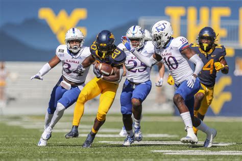 Kansas vs wvu football. The college football game between Kansas and West Virginia had an exciting ending as West Virginia drove down the field to tie the game at 42-42 with under a... 