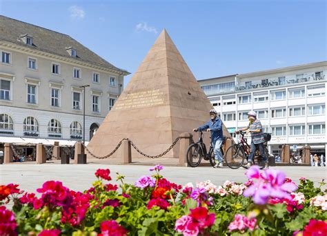 The Karlsruhe Pyramid is a pyramid made of red sandstone, located in the centre of the market square of Karlsruhe, Germany. [1] It was erected in the years 1823–1825 over the vault of the city's founder, Margrave Charles III William (1679–1738). [1] The pyramid is regarded as Karlsruhe's second emblem, the city's absolutist layout in the .... 