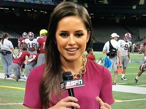 Kaylee Hartung poses for a photo prior to an NFL footb