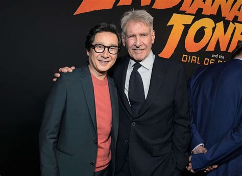 Ke Huy Quan surprises Harrison Ford at 'Indiana Jones' premiere