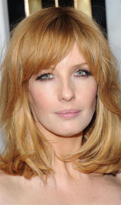 Ms. Reilly's pale green eyes and strawberry-blonde locks give her a memorable beauty that definitely turns heads - regardless of where she goes. Her hair is of average density, medium to fine in texture and is usually found in shoulder-length layered cuts with long bangs that slightly veils the eyes. Kelly Reilly hairstyles.. 