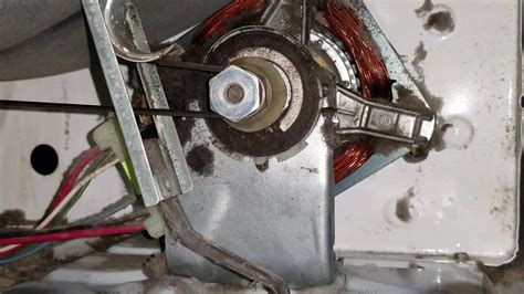 Locate the idler pulley at the bottom of the dryer; you m