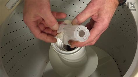 Remove the agitator from a GE washer by first removing the ag