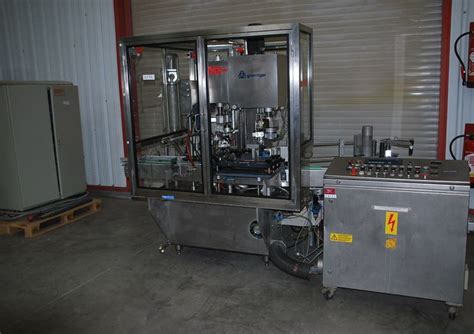Groninger Complete Line Liquid KFVG 211 A. Groninger Model KFVG211A, complete vial washing sterilizing, filling, stoppering and aluminum crimping system with number of vials per minute – depending on materials and application. Vial diameter: 10mm to 100mm and 30mm to 200mm in Height. Fill volume: 3ml to 270ml.. 