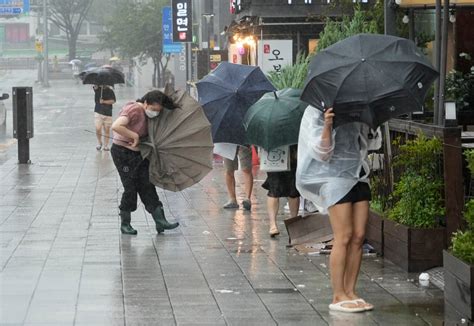 Khanun begins blowing into South Korea with strong winds after dumping rain on Japan for a week