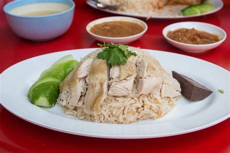 Khao man gai. Khao Man Gai $14: poached Mary's chicken with rice simmered in poultry stock and thai herbs, served with sauce of fermented soybeans, ginger, garlic, thai chillies, vinegar, and house made syrup and soy sauce. 