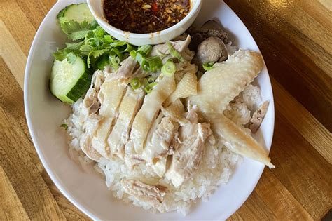 Khao man gai austin. Stuff the ginger, garlic and coriander root inside the chicken and place in a steamer. Fill the bottom of the steamer with water to a little over half–way (this will become the base for the ... 