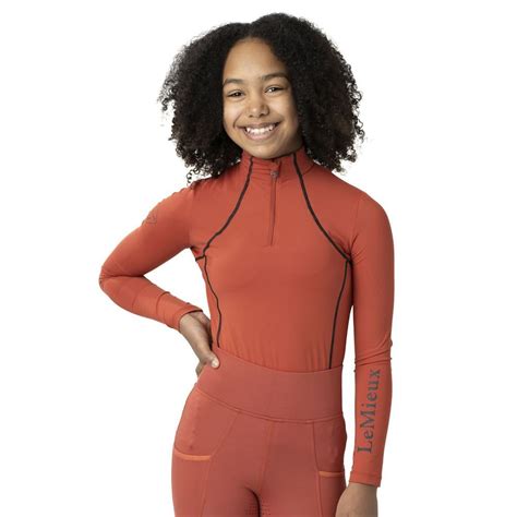 Kids base layer. Features. Made of a durable yet soft polyester/spandex blend fabric that wicks sweat and dries fast. Odor control treatment regenerates between launderings. Flatseam construction, raglan sleeves and side gussets are comfortable as you move. Extended back hem stays tucked in when you lean forward. 