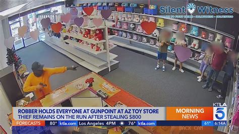 Kids held at gunpoint during Arizona toy store robbery, video shows