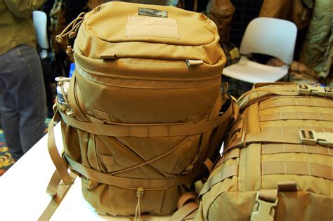 Kifaru - The Bino Holster system allowing you to always stay armed even when you drop your pack on a stalk. Designed to attach to the molle/pals webbing on the bottom of the Kifaru bino pack utilizing a single malice clip for extreme durability and simplicity. Torso strap included to ensure the holster remains tight to the body.