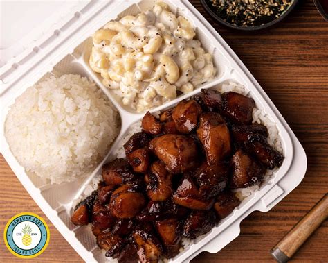 Each plate has a main dish (chicken, pork, or veggies), rice