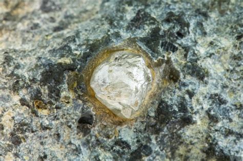 Kimberlite is basically a form of peridotite in other words composed dominantly of olivine, a particular type of chrome rich granite and you’ll see why this is important when we come to talk about diamond …. 