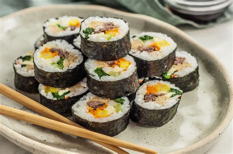 Kimbop. Instructions. To make the kimbap rice, place the rice in a bowl and add the sesame oil and salt. Mix using a rice paddle until the rice is evenly coated. Cover with a kitchen towel and set aside. In a medium pan, add 1 … 