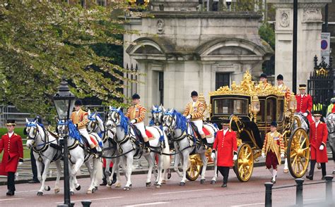King Charles III leaves Buckingham Palace in horse-drawn carriage to be crowned at Westminster Abbey