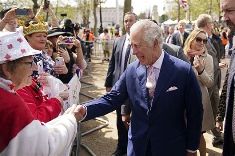 King Charles III surprises crowd outside Buckingham Palace ahead of coronation