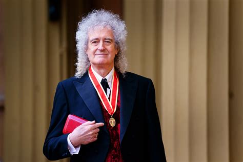 King Charles knights Brian May of Queen