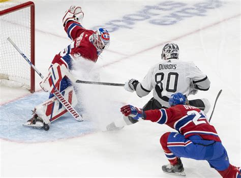Kings blank Canadiens 4-0, set the NHL record with their 11th straight road win to open season