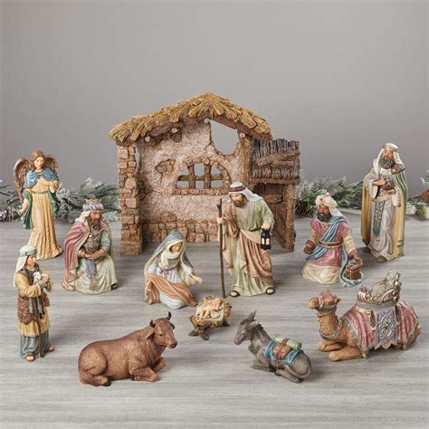Kirkland 13 piece nativity set with wood creche base. This is a stunning nativity set from Kirkland. The pieces are beautifully detailed with vivid colors and jewels. This set comes with a wood creche that requires assembly. It comes in its original box which has wear. ... Amish-Made … 
