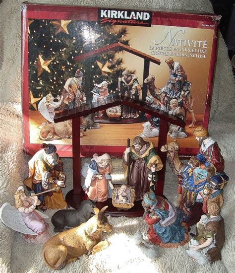 Kirkland manger scene. Complete and pristine!!! This beautiful nativity set by Kirkland Signature is the perfect addition to your Christmas decorations. It features 13 pieces, including Joseph, Mary, and baby Jesus, as well as animals like sheep and camels. The set is made of high-quality porcelain and comes with a wooden creche base. Celebrate the holiday season with this vintage nativity set, which is sure to ... 