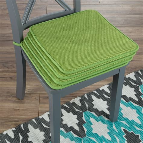 Instantly update your favorite patio dining chairs with this four-piece tufted cushion set! Made in the USA from cotton/polyester twill fabric in a versatile solid hue, the cushion cover features deep button tufts and a sewn edge for a tailored touch, while a 3.5" thick polyester fill cushion within provides comfortable support.. 