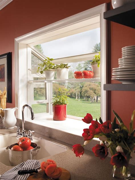 Kitchen greenhouse window. A garden window is made up of five separate windows that are joined together to form a three-dimensional window unit that protrudes from the exterior of a home. 