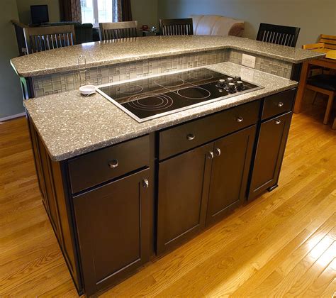 Kitchen island with cooktop. Sep 20, 2023 ... Since counter cooktops and slide-in ranges are close to walls and cabinets, food and grease can splash, making cleaning difficult. Food can get ... 