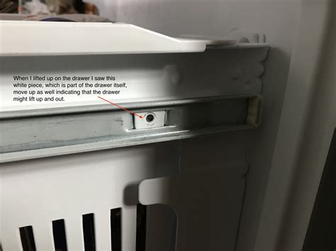 Re: KitchenAid Bottom Freezer Drain clogged- need to remove drawer to gain access. « Reply #1 on: October 04, 2012, 04:07:45 PM ». Pull the drawer all the way out. About 3/4 of the way back of the rails on each side is a plastic locking tab. Push the tabs in and pull the drawer the rest of the way out. Logged. . 
