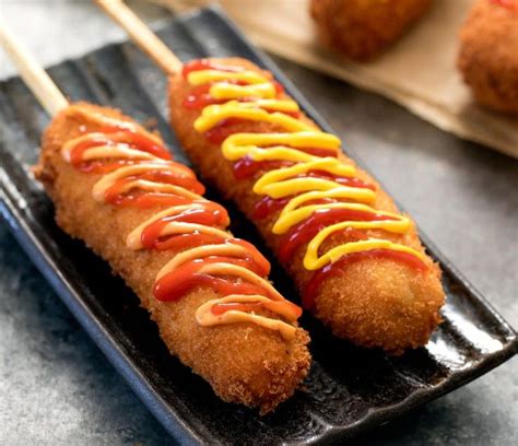 Korean hotdogs. Corn dogs gained popularity as a Korean street food in the 1980s, but the current corn dog trend—which sees more than just hot dogs coated in more than just cornmeal batter—is generally ... 
