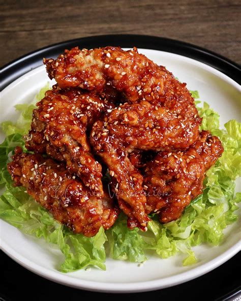 Korean wings. Preheat the oven to 475 degrees F, and place the chicken on a sheet pan lined with non-stick aluminum foil or parchment paper. Brush the chicken on all sides lightly with vegetable oil. Bake in the oven, flipping them once halfway through. If using chicken wings, bake for 30-35 minutes. 