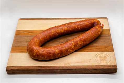 In Ukraine, kielbasa is called "kovbasa". It is a general term that refers to a variety of sausages, including "domashnia" (homemade kovbasa), "pechinkova" (liver kovbasa), and "budzhena" (smoked kovbasa). It is served in a variety of ways, such as fried with onions atop varenyky, sliced on rye bread, or eaten with an egg.