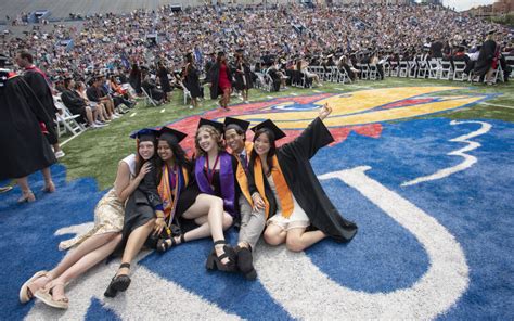 At the beginning of a commencement ceremony, students wear