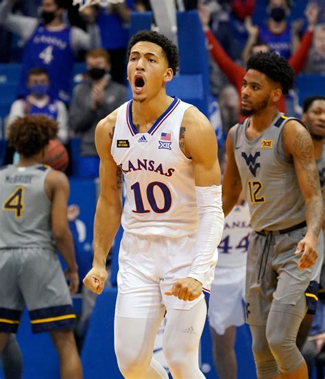 Mar 1, 2023 · Lawrence. Jalen Wilson tapped his left ring finger with the index finger of his right hand, once, twice, then three times, wearing a big smile on his face as the final buzzer sounded in Kansas ... . 