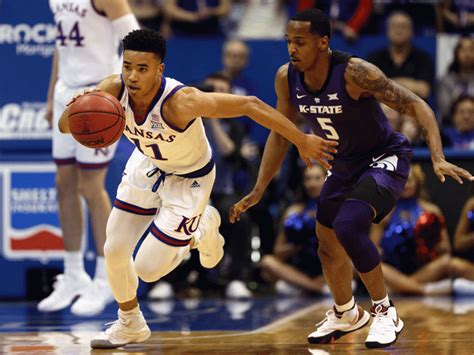Ku k-state basketball score. Kansas State took its remarkable turnaround season to new heights on Tuesday as the No. 13 Wildcats upset No. 2 Kansas 83-82 in overtime at Bramlage Coliseum. 