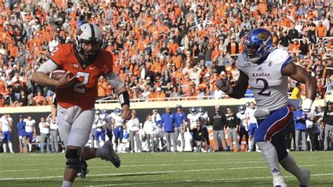 Oklahoma State's Brennan Presley rushes the ball down the filed during the game against the University of Kansas at Boone Pickens Stadium Saturday, Oct. 14, 2023 Karlie Boothe OSU versus KU. 