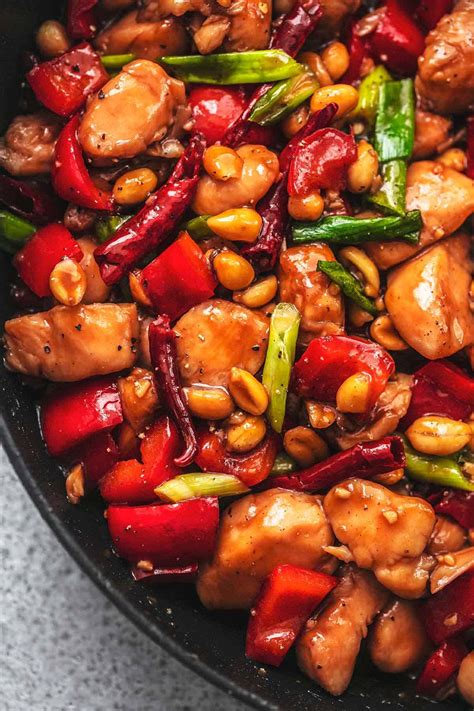 Kungpao chicken. Kung Pao Chicken is a spicy stir-fry dish, prepared with marinated diced chicken, peanuts, red bell peppers & zucchini, tossed in a wok with fresh green ... 