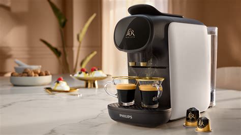 L or coffee machine. L'Or Barista. L'OR BARISTA® Coffee Machine - Premium Latte. $ 249 .00. L'Or Barista. L'OR BARISTA® COFFEE MACHINE–SUBLIME-RUBY-FREE when purchasing capsules*. $ 159 .00. FREE MACHINE-SPEND $120 ON CAPSULES. L'Or Barista. L'OR BARISTA® COFFEE MACHINE–SUBLIME-BLACK-FREE when purchasing capsules*. 