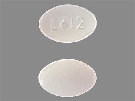 6 23 Pill - white capsule/oblong, 9mm. Pil