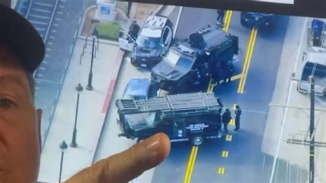 LIVE: Police standoff underway with Uber passenger armed with a gun